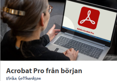Ulrika vid laptop, på skärmen syns röd symbol med kringelikrokigt A, logotypen för Adobe Acrobat